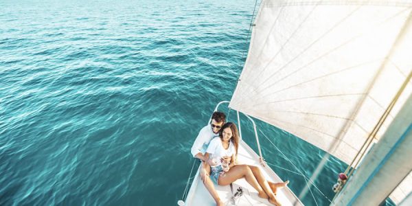young-couple-relaxing-on-yacht-cruise